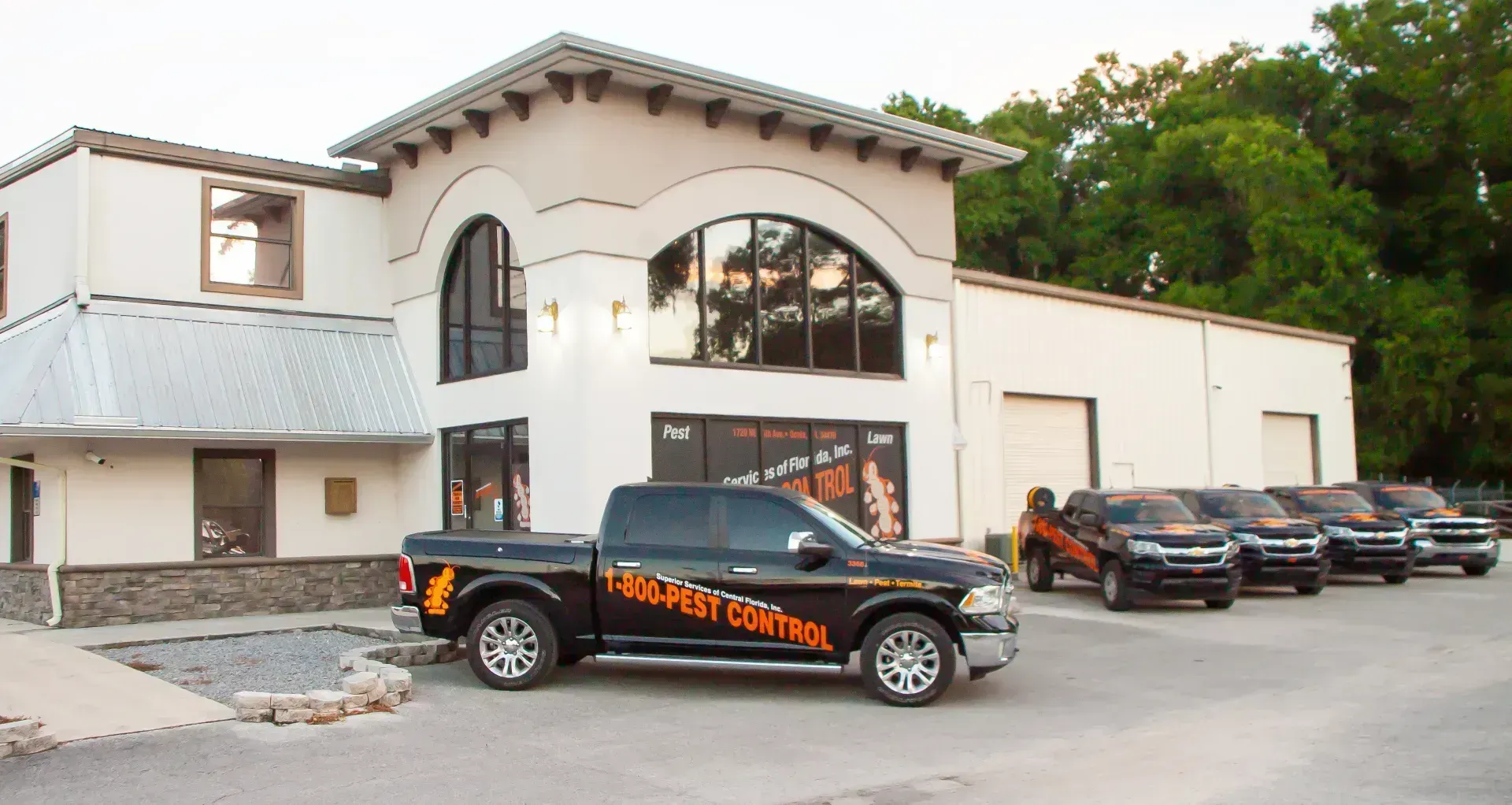 Superior Services technician treating a Central Florida home exterior